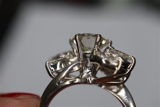 An 18ct white metal and single stone diamond ring, with marquise cut diamond set shoulders, size H/I.